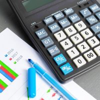 Bookkeeping tools including calculator and financial reports for small business accounting