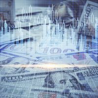 Hands typing on a keyboard while managing bookkeeping tasks and small business financial records